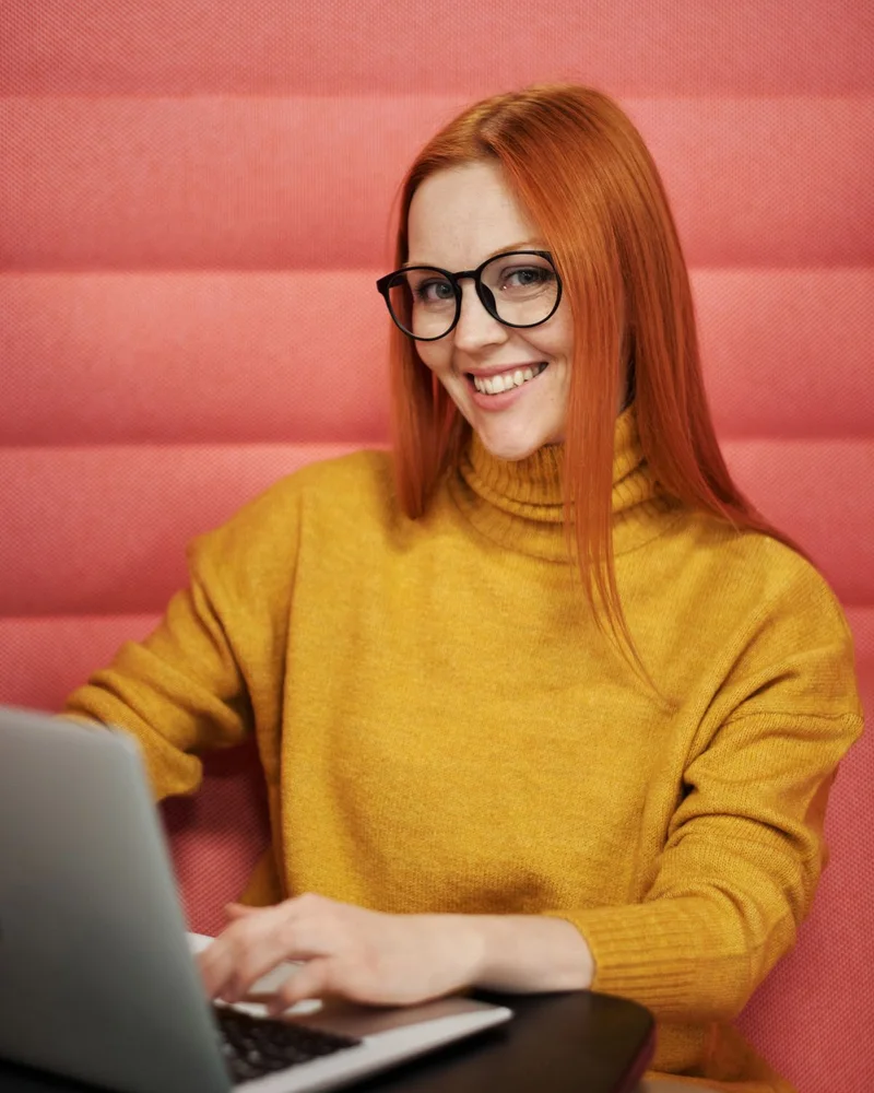 A publisher writing at a laptop